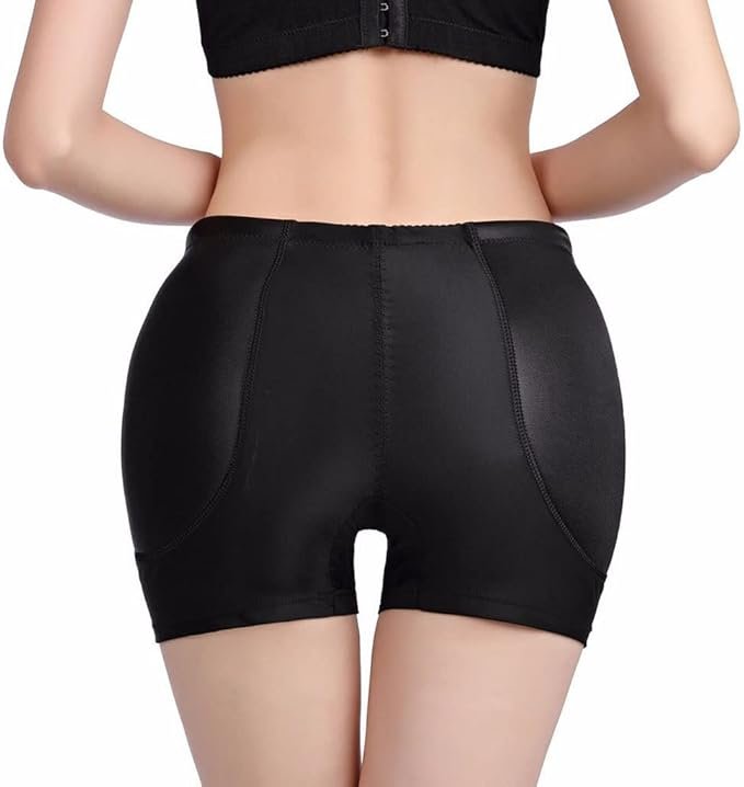 Back view of a woman wearing black fitted shorts and a cropped top.