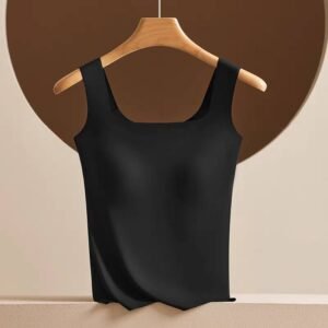 A black sleeveless top hanging on a wooden hanger against a neutral background featuring a circular shape.