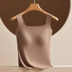 A beige sleeveless top displayed on a wooden hanger against a brown circular background.