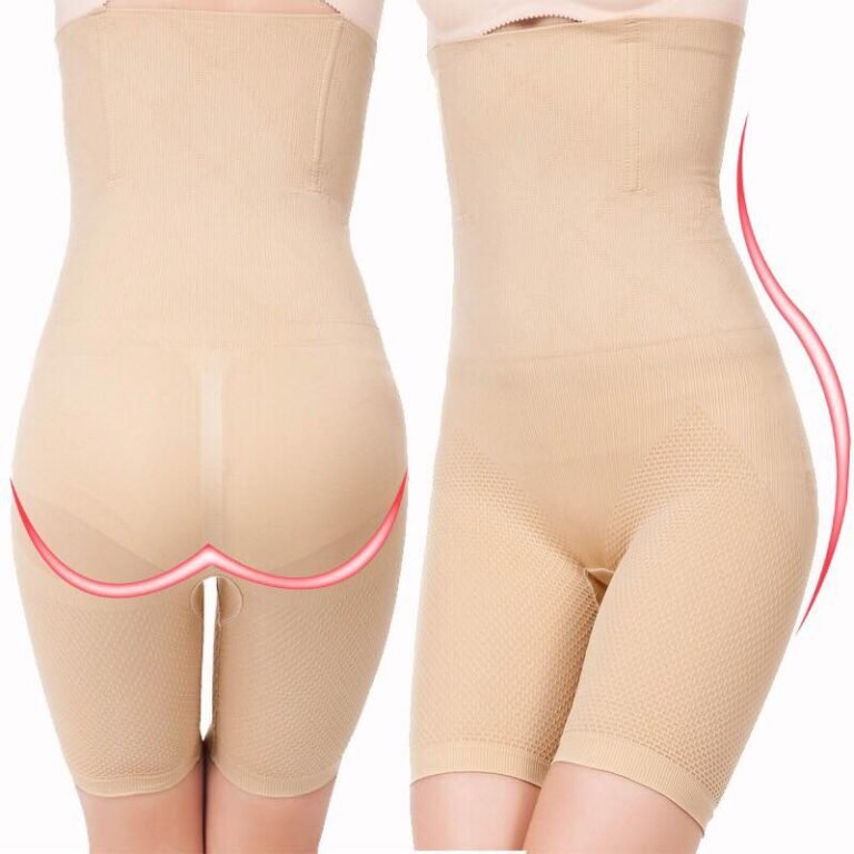 A pair of beige high-waisted shapewear shorts designed to provide support and smooth the figure, featuring textured fabric and elastic waistband.