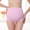 High waist maternity panty in light pink color displayed on a model's waist.