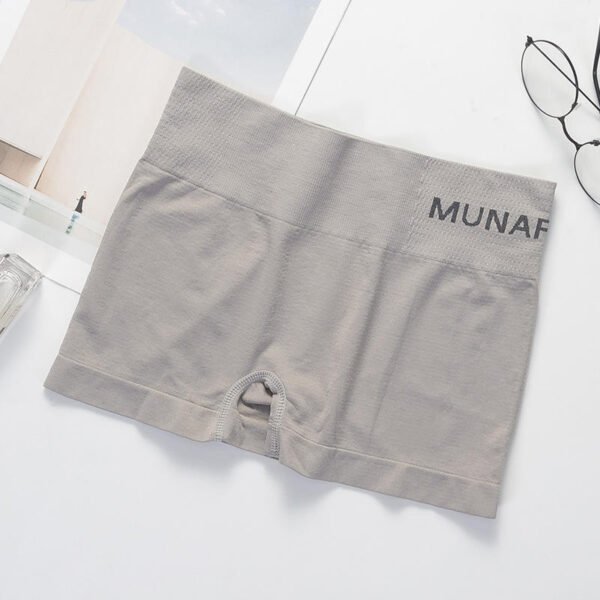 Pair of gray Munafie shorts laid flat on a surface with minimal props